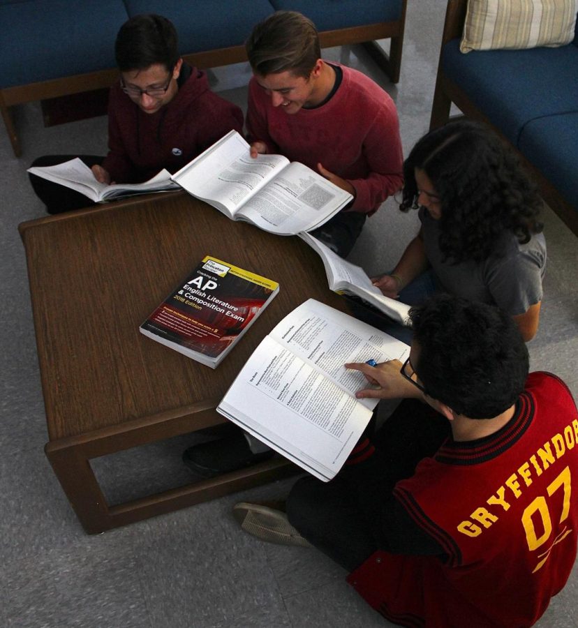 In a photo from last year, editors browse through study guides for standardized exams.