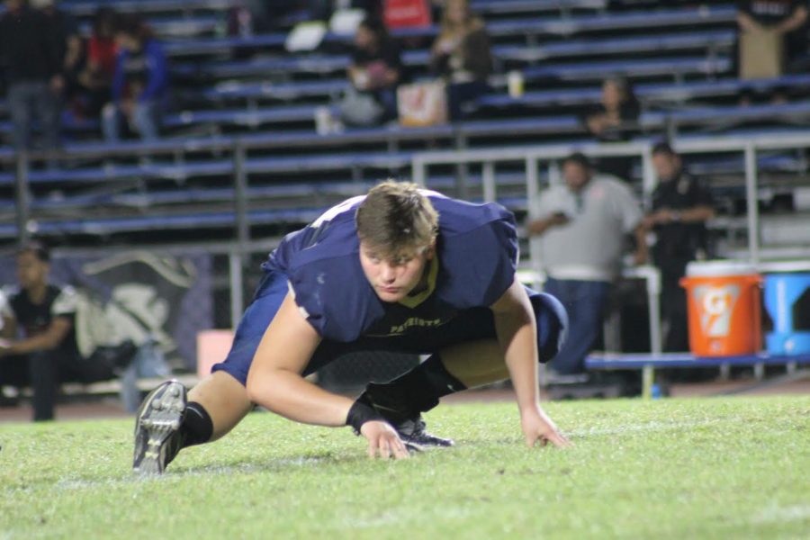 Varsity+football+player+Kyle+Matson+warming+up+before+last+years+homecoming+game.