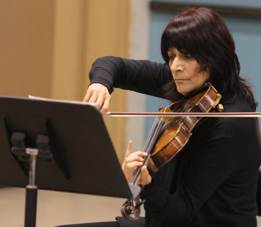  Beth Elliott plays the viola during the Kadima Quartet performance during third period on Oct. 8.