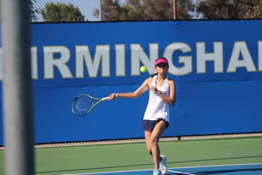 Christine+Valenzuela+swings+her+racket+in+her+doubles+match+on+Aug.+23+against+Marshall+High+School.+