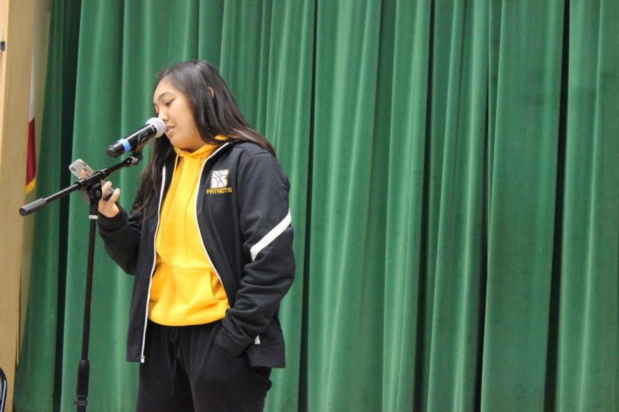 Junior Keona Paniagua recites her poem for the Get Lit assembly.