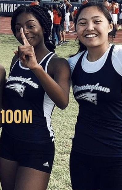 Queen Baskerville and Keona Paniagua pose after a meet. 