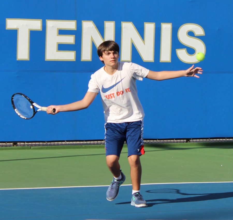 Freshman Evan Gleason practices rallying against a teammate on March 7 for the upcoming tennis match against El Camino Real Charter High School.
