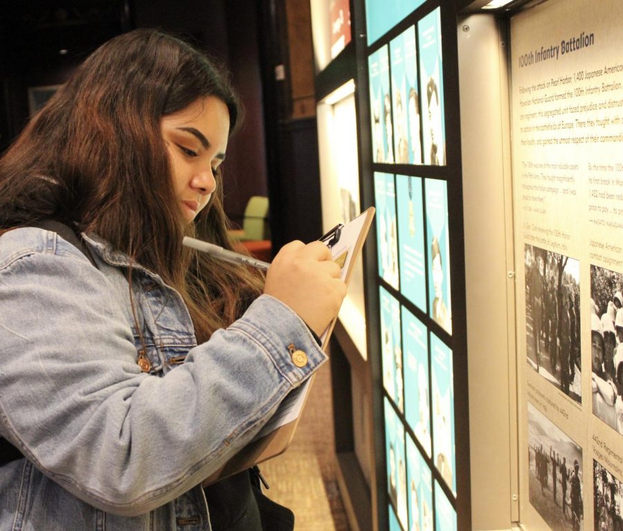 Sophomore Emily Rodas completes a handout at the Go For Broke Museum on March 16. 