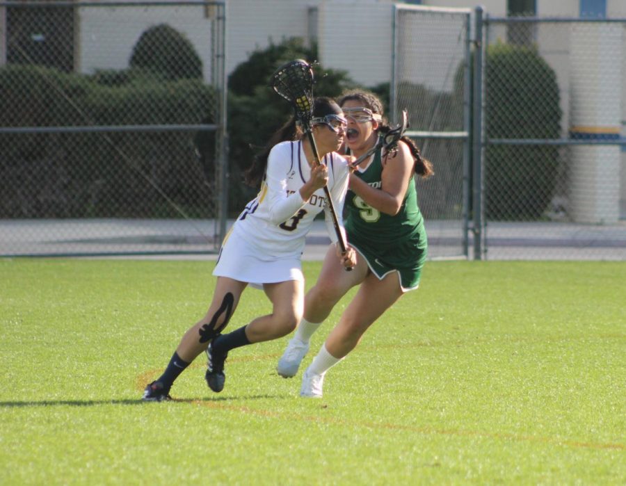 Varsity player Maria Ruiz runs with the ball during the match against La Cañada High School. Birmingham Community Charter High Schools girls varsity lacrosse team won 19-11.