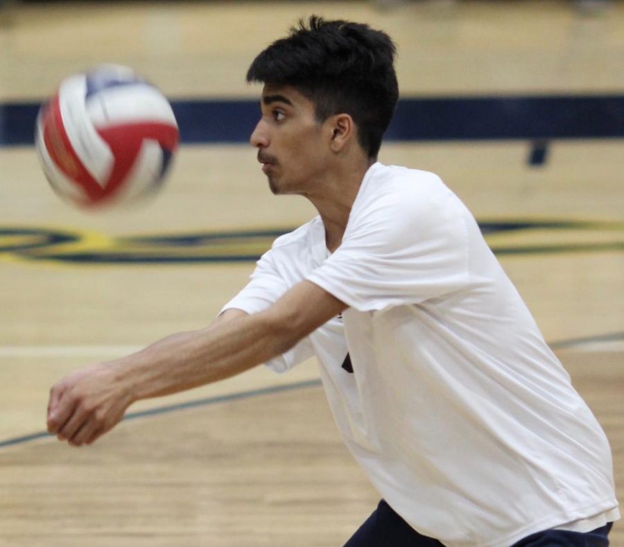 Sophomore Om Patel hits the ball during a game against Taft Charter High School on April 5. 