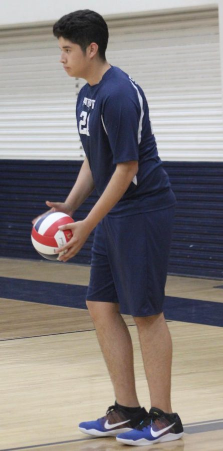 Junior varsity Antonio Serrano gets ready to serve the ball during a game against Granada Hills Charter High School on March 29.
