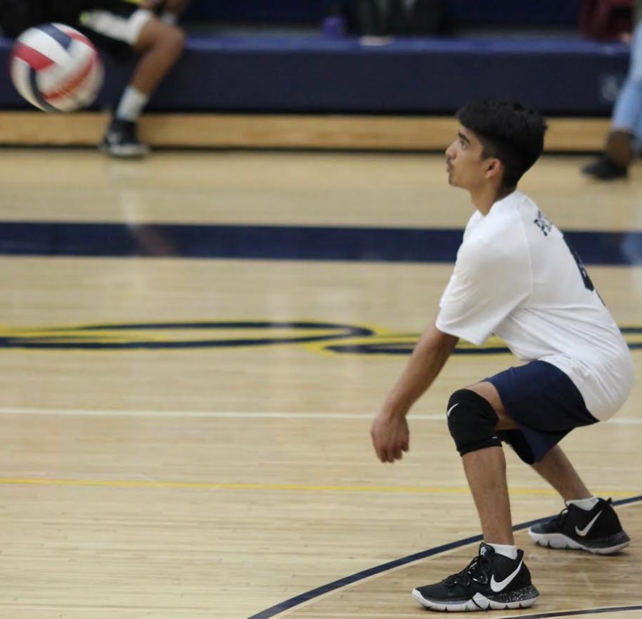  Sophomore Om Patel hits the volleyball during a game against Taft Charter High School on April 5.