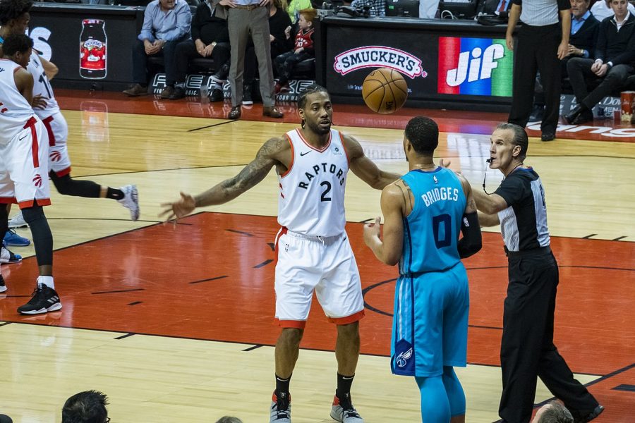 Kawhi Leonard of the Toronto Raptors confronts Charlotte Hornets Miles Bridges during a game on March 25.