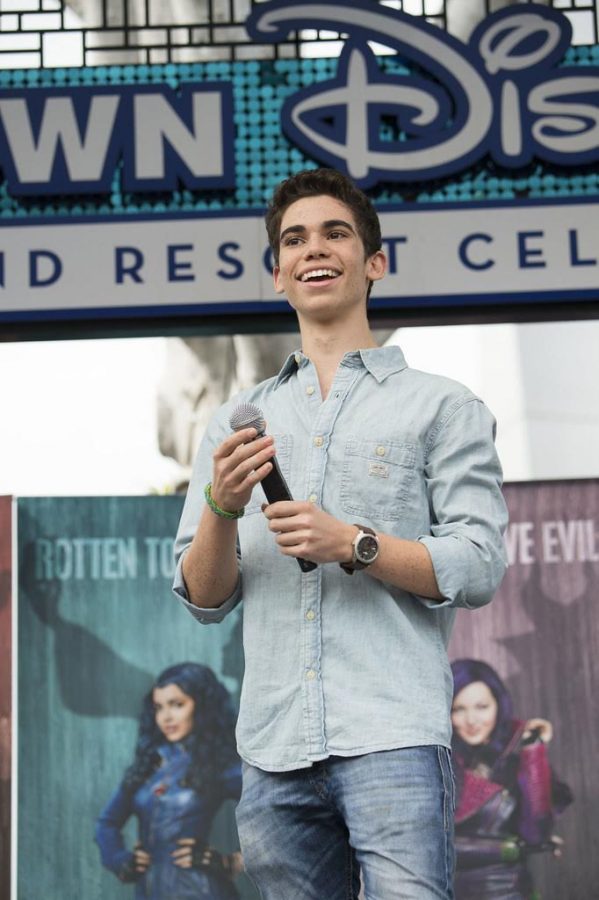 Cameron Boyce celebrates the announcement of the Descendants sequel during an on-stage fan event at Downtown Disney District on Oct. 17, 2015. 