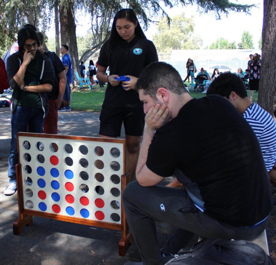 Senior Keona Paniagua plays an intense game of Connect 4 during Fiesta Friday on Sept. 6.