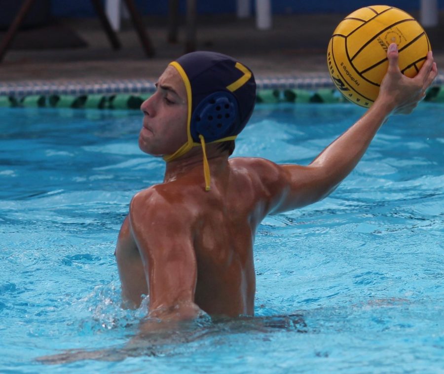 Sophomore+driver+number+seven+Yoni+Zelig+gets+ready+to+throw+the+ball+during+water+polo+practice+on+Sept.+12.+