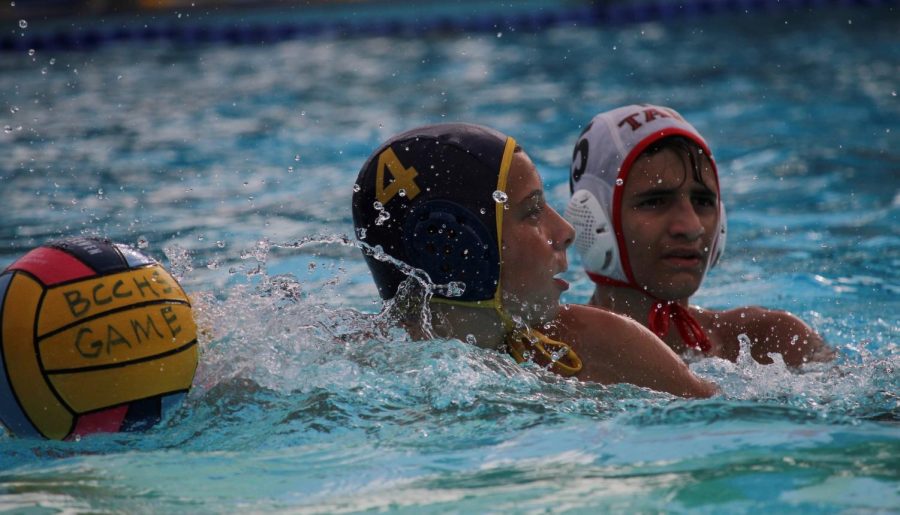 Freshman number four Ryan Nevsky passes ball to teammate during a Birmingham Community Charter Boys Water polo game against Taft Charter High School on Oct. 16.