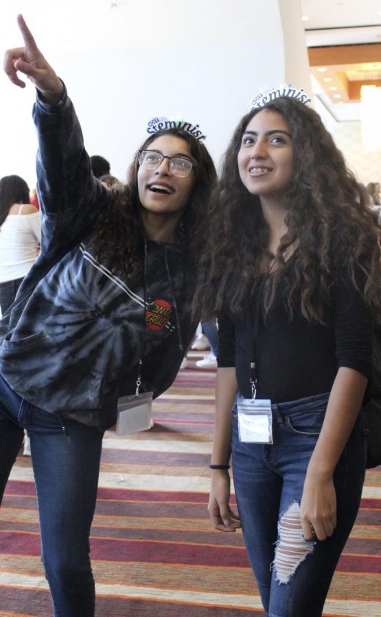 Juniors Maria Strake and Brenda Zaragoza stare in astonishment at a display during the Third Annual State of Women and Girls event held at the JW Marriot Hotel on Oct. 2. 