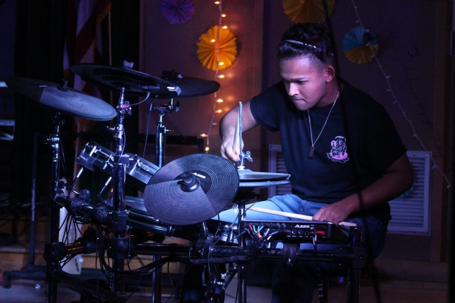 Senior Ashiq Siddiqui plays the drums in the song Dancing Queen by ABBA during Daniel Pearl World Music Day on Oct. 28