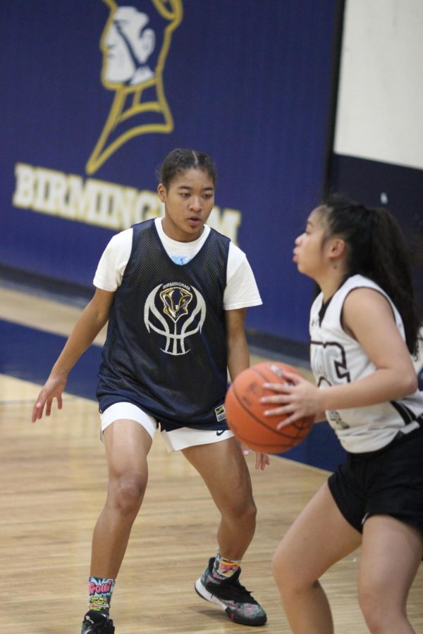 Sophomore varsity player Janna Holley plays defense against a teammate during practice game on Nov. 18.