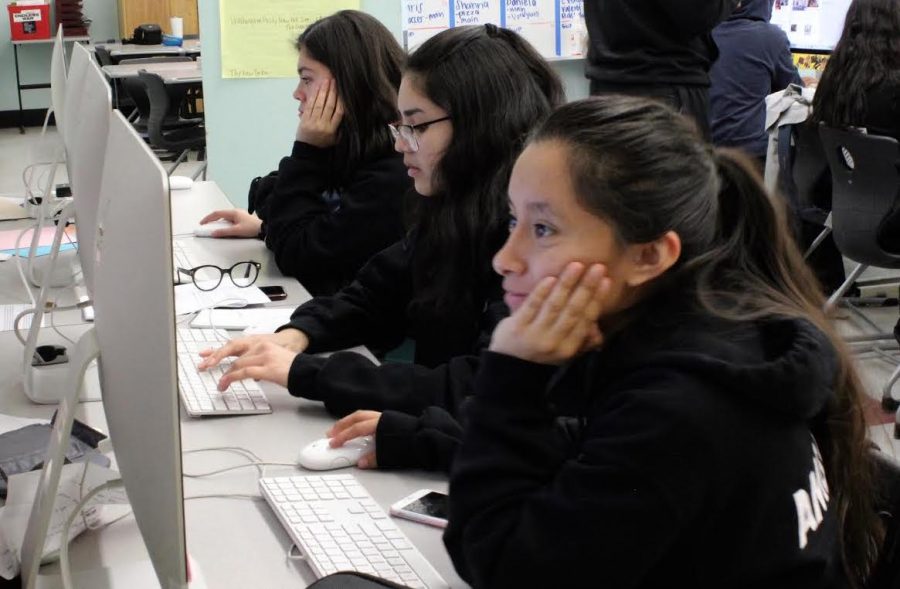 Staff writers Valery Barrera, Valeria Luquin and Maribella Ambrosio work during period 3 on Jan. 29. Student media staff, who produce content for the yearbook, news magazine, website and social media, all work together in one class period.