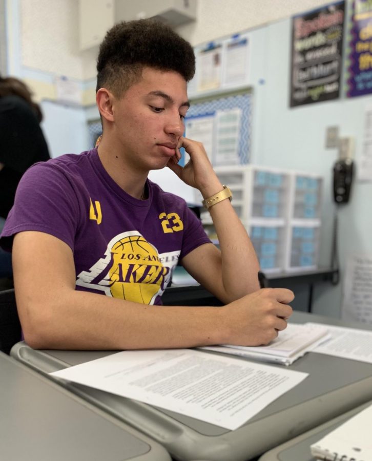 Senior Tylin Jarret wears his Lakers shirt for Lakers Day on Jan. 31. Students and staff wore Lakers merchandise or colors to commemorate the death of Kobe and Gianna Bryant.