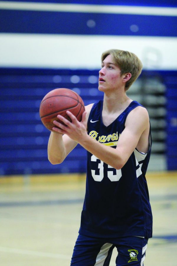 Senior forward Cuyler Huffman prepares to shoot
the ball during practice on Jan. 30.