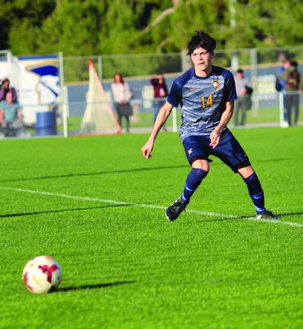 With the sun beating down on him, senior and varsity player Christopher Rodriguez races towards the ball on Jan. 24 during the Birmingham Community Charter High School game against El Camino Real Charter High School. 
