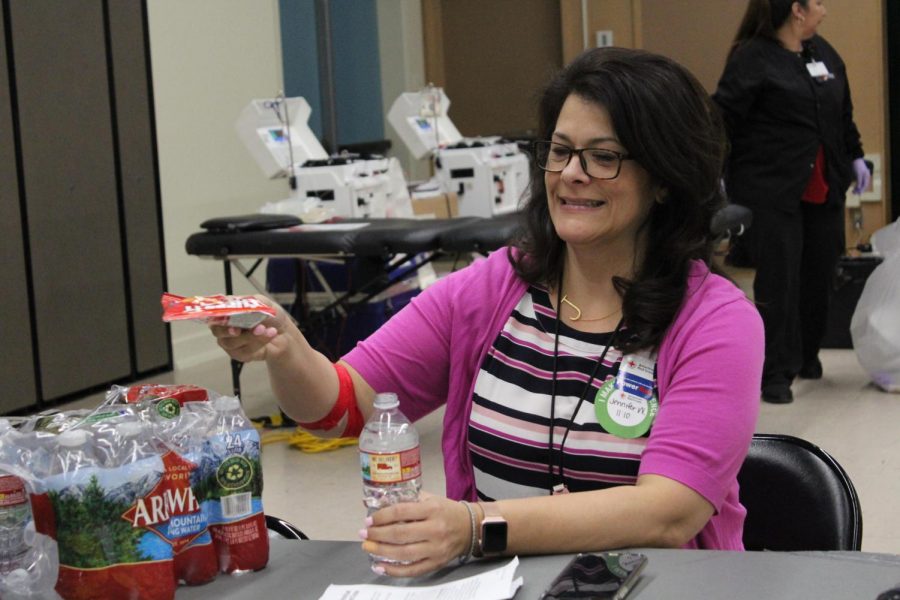 Resource teacher Jennifer Walker grabs a snack as she recovers from getting her blood drawn at a past Red Cross Blood Drive. (file photo)