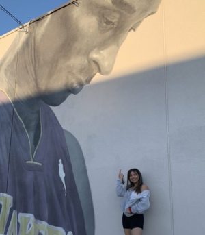 Sophomore Eden Kolber at a mural honoring the late basketball player Kobe Bryant. 