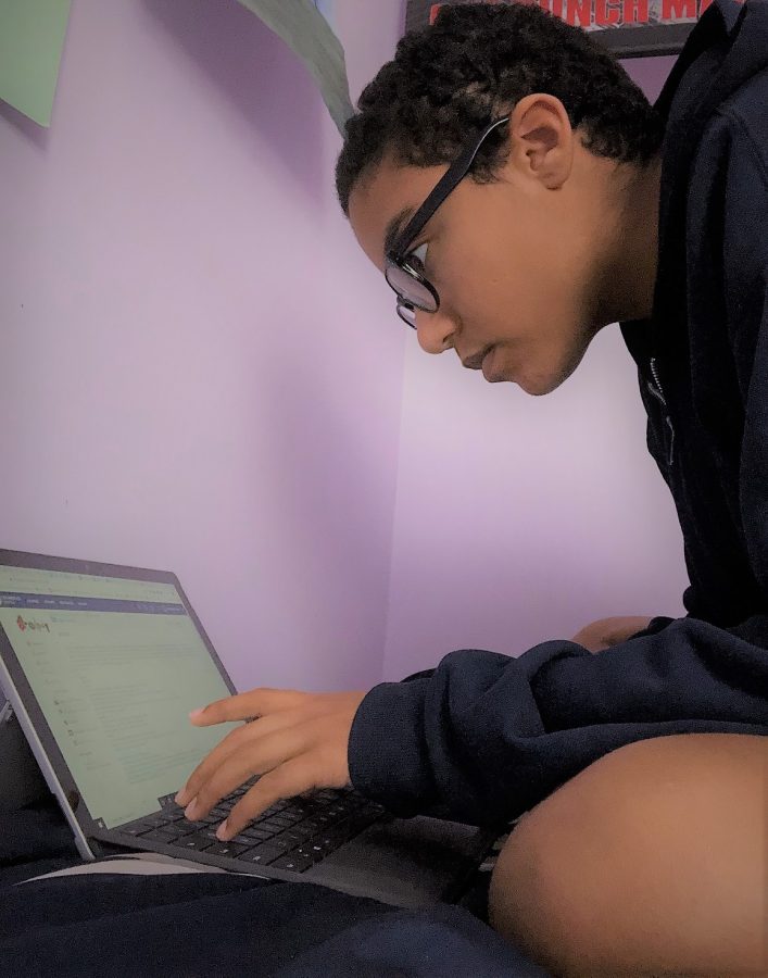 Freshman Naamah Silcott works on her online schoolwork during this semester of remote learning. 