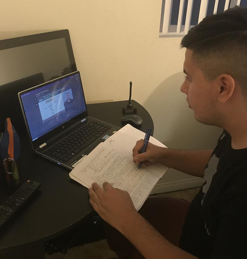 Senior Ariel Davila works on his math work through the virtual platform, Edgenuity, during this distance learning school year. 