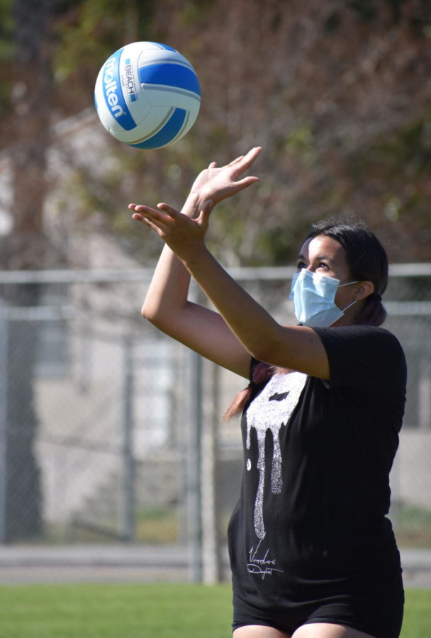 Freshman Cheyenne Losino gets ready to serve the ball during volleyball practice on April 9.