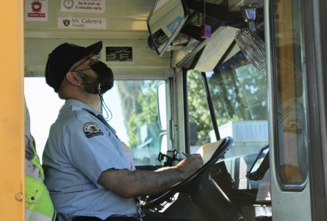 LAUSD school bus driver Ismael Cabrera keeps an eye on the students boarding his bus after school on Nov 10.