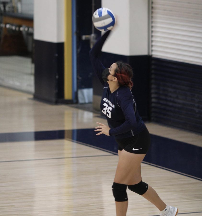 Sophomore+and+Varsity+Volleyball+player%2C+Cheyanne+Lossino+serves+the+ball+against+Cleveland+Charter+High+School.