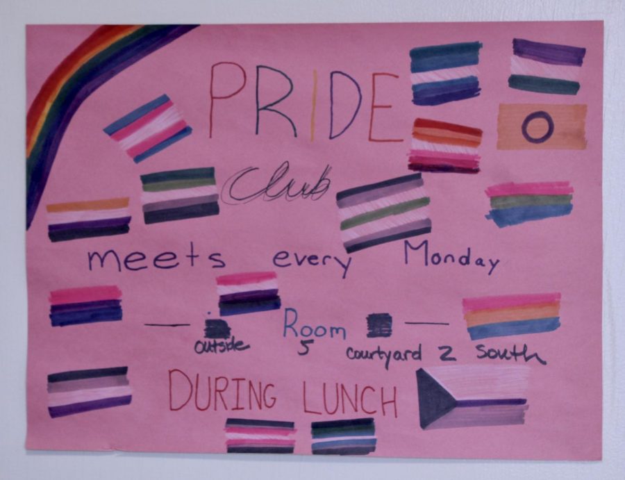 Several Pride Club posters hang in the school halls showing when and where the club meets.