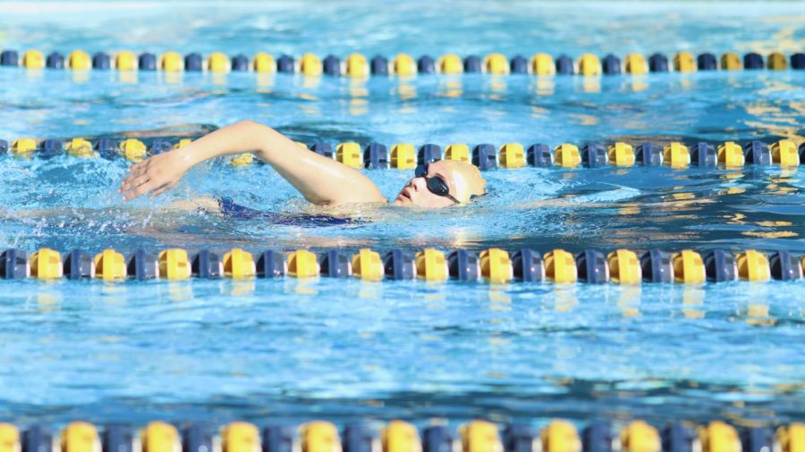 Junior Sabrina Robertson warms up before a swim meet on March 1. 