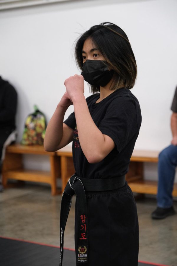 Junior Jenica Felicitas gets into a ready stance during a martial arts lesson.