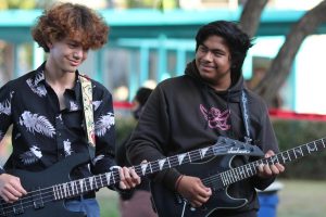 Senior William Myers and junior Emmanuel Recinos play My Kind of Woman by Mac DeMarco on their guitars during the spring concert on May 4.