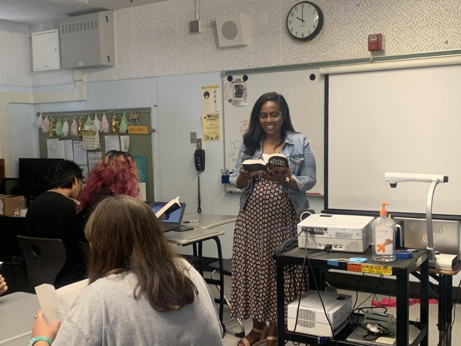 English teacher Dejanae Sharp reads to her 10th grade honors English class.