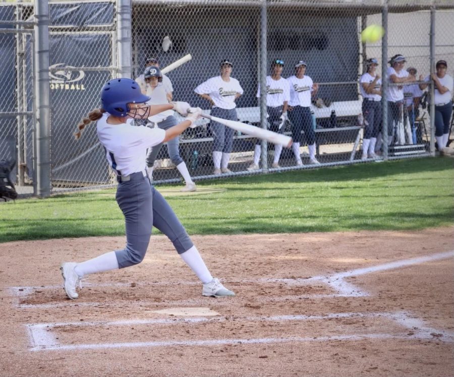 Varsity softball left fielder Danielle Gonzalez hammers the ball to left center field  during her team’s March 30 matchup against the Providence High School Pioneers.