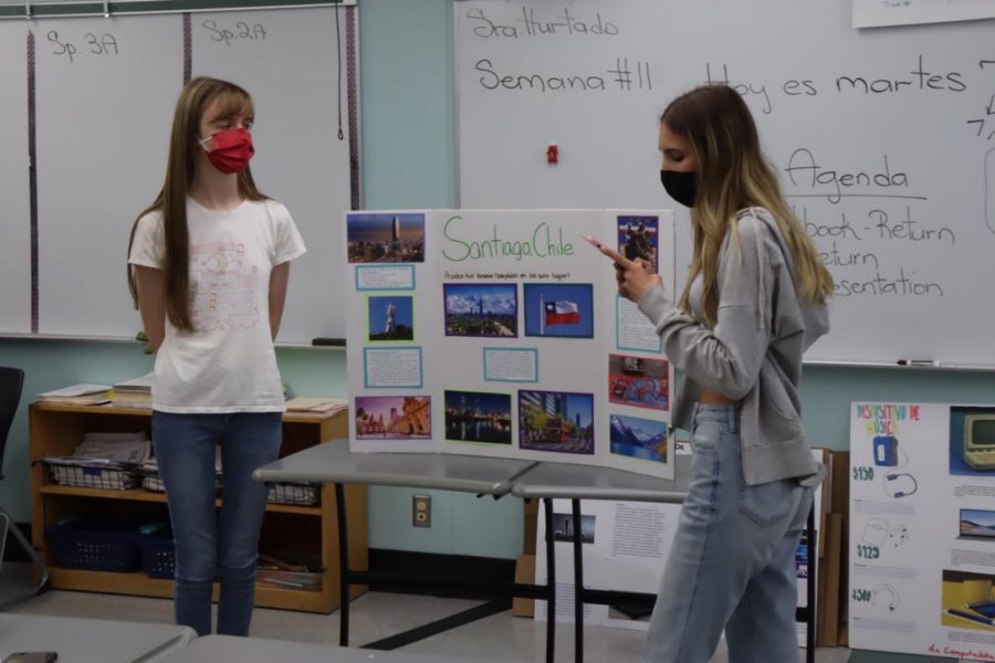 Sophomores Desiree Spurkel and Monica Gonzalez give their presentation based on Santiago, Chile during Glenda Hurtados fourth period on June 8. 