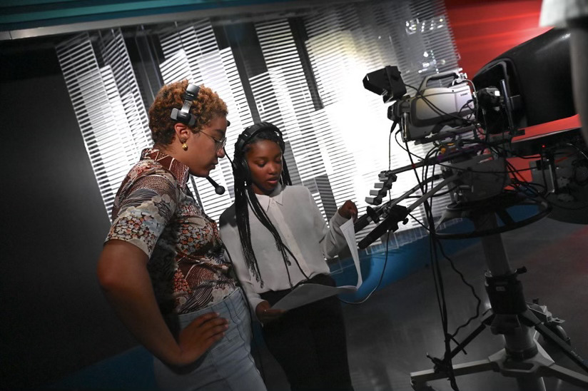 Gabrielle Lashley and Naamah Silcott read and discuss the script for the EJP News broadcast on June 28. 