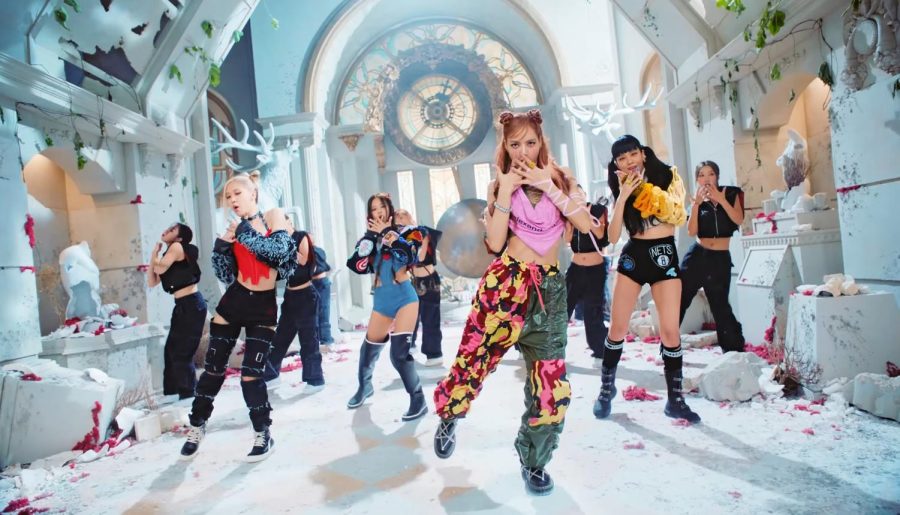 BLACKPINK released its highly anticipated music video Pink Venom a few weeks ago. In the photo from left to right Rose, Jennie, Lisa and Jisoo all dance to the choreography from Pink Venom in a run-down museum set. Their back-up dancers dressed in black behind them. 