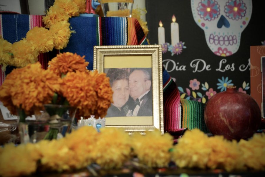 An altar by the main office includes a photograph of Office Tech Lupe Osorios parents.