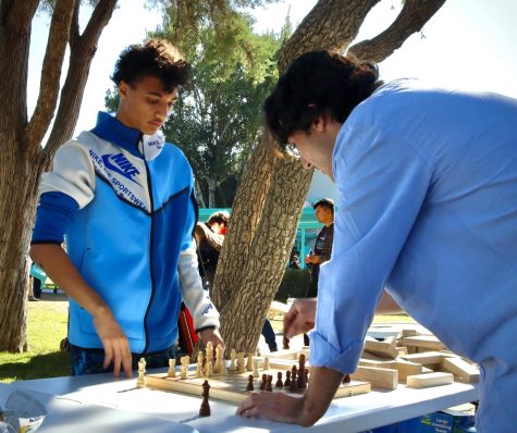 Avid chess player Daryon Bush plays against paraprofessional Humberto Renderos in a friendly game of chess on Nov. 18 during Fiesta Friday. Bush who is a freshman, hopes to make chess more than a hobby in the future. 