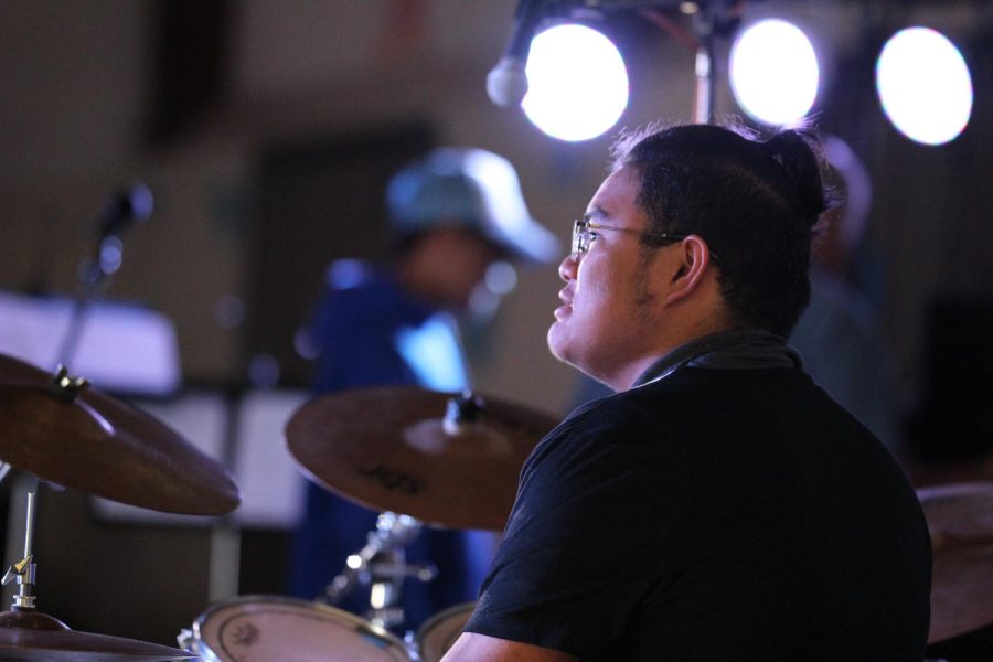 Senior Ralph Uy De Ong practices “Here Comes Santa Claus” by Elvis Presley before the Holiday Concert on Dec. 14.
