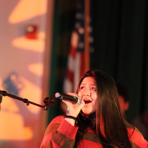 Senior Jiszelle Arana sings Love to Keep Me Warm by Laufey and Dodie during the Holiday Concert on Dec. 14.