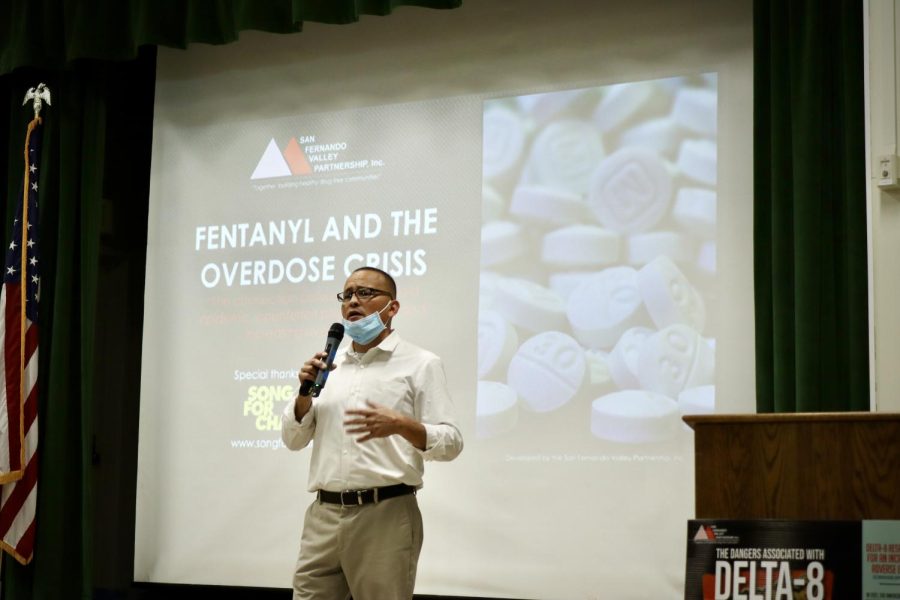 Albert Melena of the San Fernando Valley Partnership makes an opening statement during the school fentanyl assembly on Jan. 12. Melena and his team partnered with Song For Charlie, an organization put together by the parents of a teenager who unintentionally overdosed on fentanyl.
