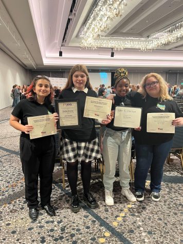 The Pearl Post Opinion Editor Satenik Ayrapetyan, Print Editor-in-Chief Delilah Brumer, Art Director Gabrielle Lashley and Features Editor Angela Ledesma hold up award certificates after the National High School Journalism Convention closing ceremony on Saturday, April 22. The staff earned Eighth Place for print newsmagazine (small schools) in Best of Show and made it to the buzzer round of the Quiz Bowl. Brumer was named Runner-Up for the 2023 National High School Journalist of the Year and earned an Excellent Award for news editing in the National Student Media Contests.