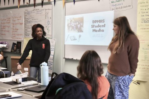 Art Director Gabrielle Lashley and Print Editor-in-Chief Delilah Brumer give a presentation to recruit for next years student media staff during a Quill and Scroll club meeting. 