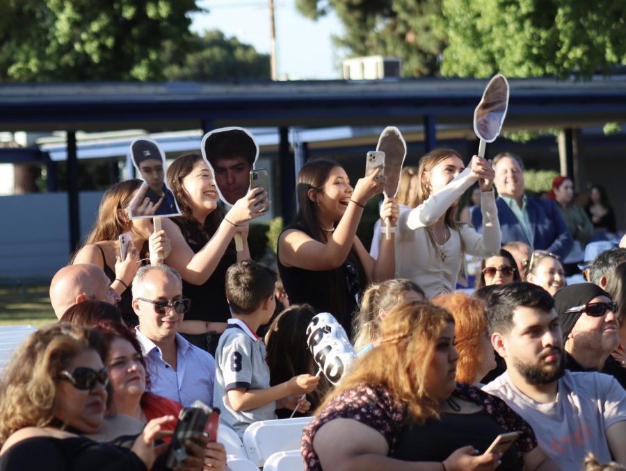 Crowd members cheer for senior Mario Ronquillo during the Class of 2023 graduation ceremony on June 8. 