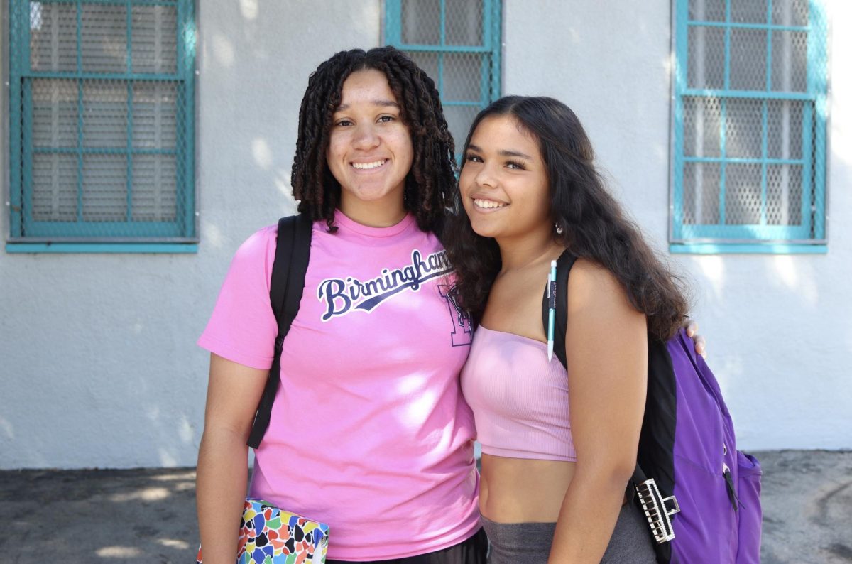 Freshmen Andrea Arosemena and Ava Weinstein represent their class by wearing pink for Color Wars on Sept. 8.