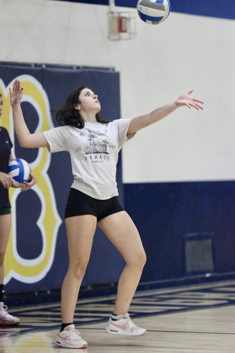 Junior+varsity+volleyball+player+Genevieve+Gonzales+serves+the+ball+during+after+school+practice+at+Birmingham+Community+Charter+High+School+on+Oct.+8.+The+JV+girls+volleyball+team+ended+their+season+on+Oct.+11+with+a+total+of+11+wins+and+seven+losses.+